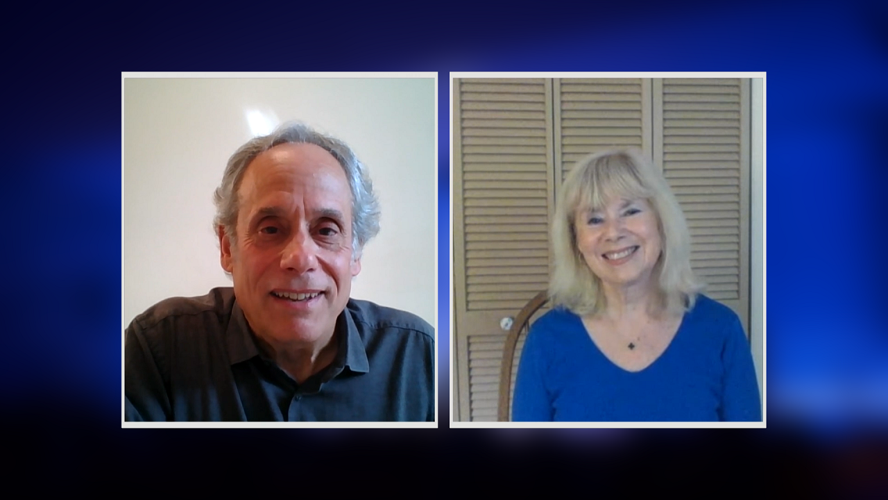 A screenshot from a video conference call featuring a male moderator and a female participant.