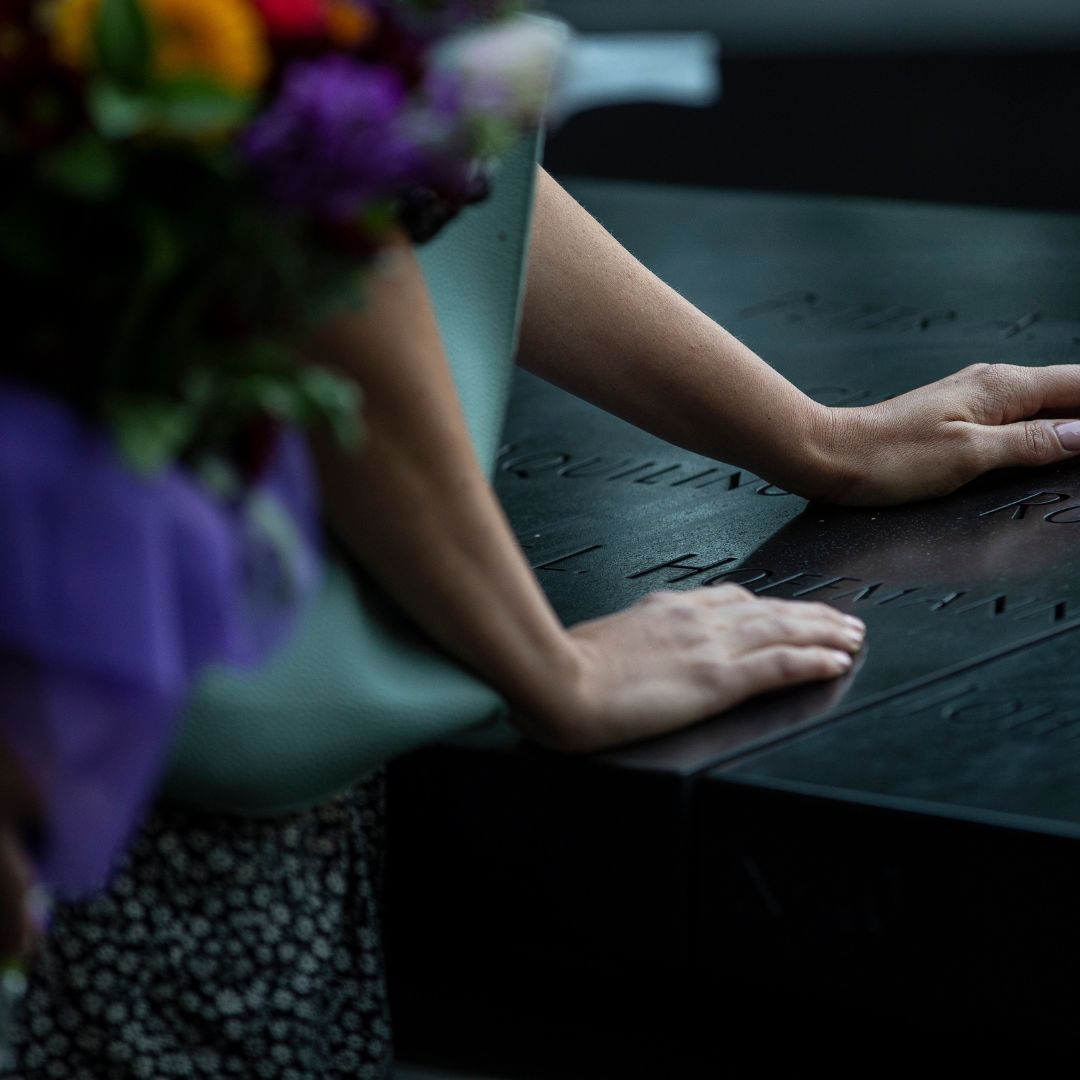 Hands on the Memorial 