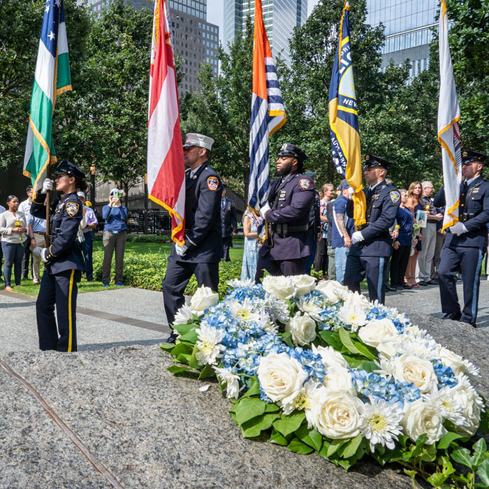 first responders carry their departments' flags in the Glade