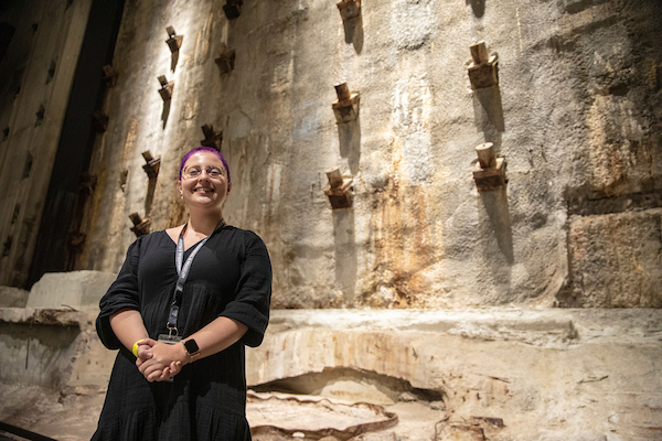 A young woman in front of Slurry Wall